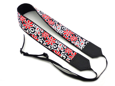 Padded camera strap with red and white flowers for DSLR SLR and mirrorless cameras.