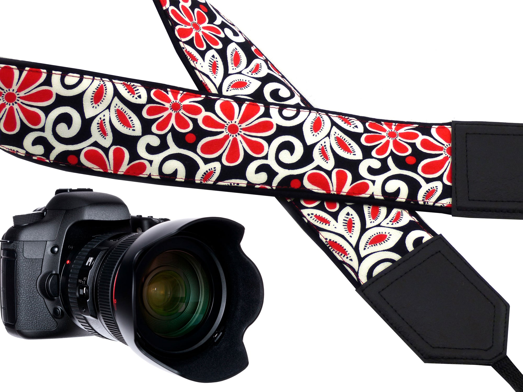Padded camera strap with red and white flowers for DSLR SLR and mirrorless cameras.