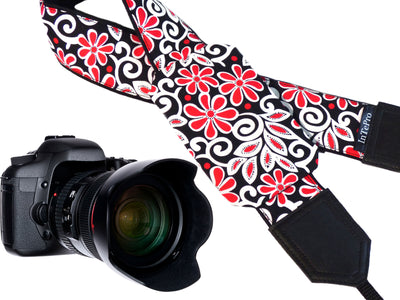 Padded camera strap with red and white flowers for DSLR SLR and mirrorless cameras.