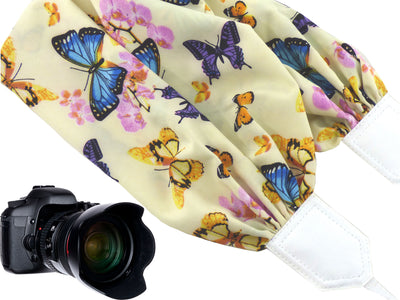 Colorful camera strap with flowers and butterflies.
