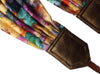 Scarf Camera Strap with colorful flowers design and golden ends.